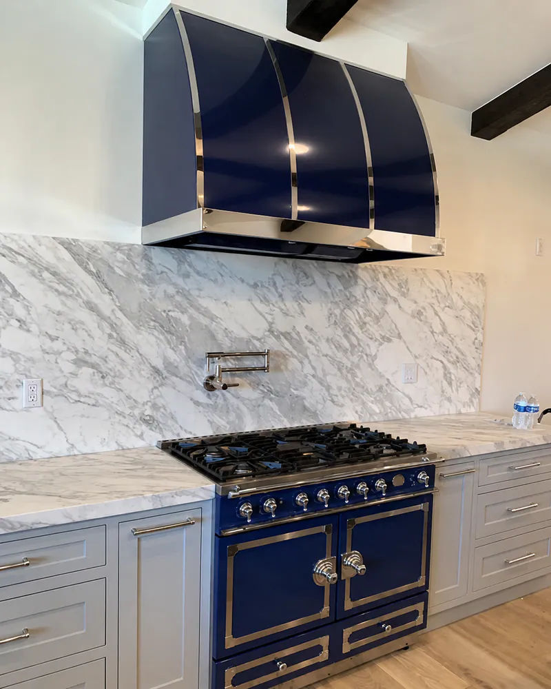 La Cornue range and navy hood in Newport Coast