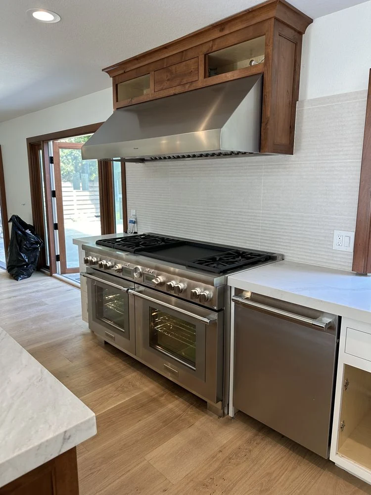 Professional stainless range and ventilation hood installation in Orange County
