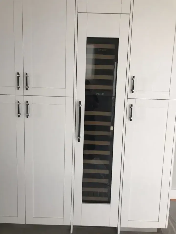 Sub-Zero Wine Column with Custom Wood Panel installation in Laguna Beach by Peerless Group