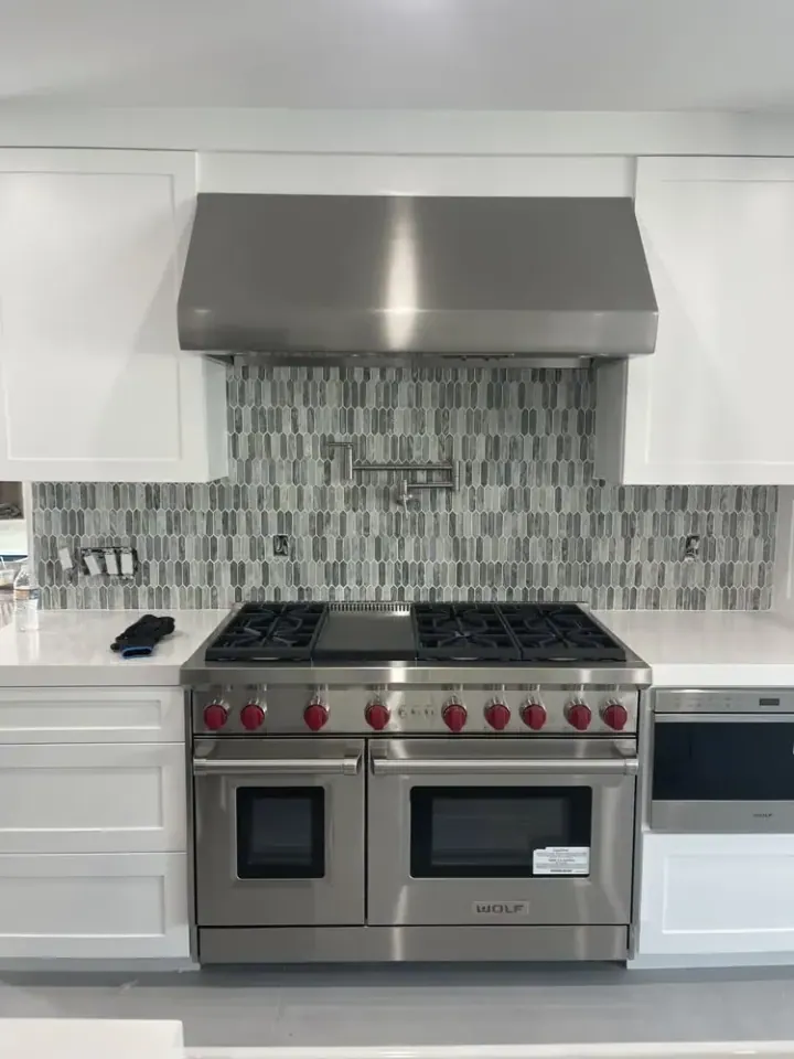 Wolf 48″ Range and Wolf Hood installation in Stanton by Peerless Group