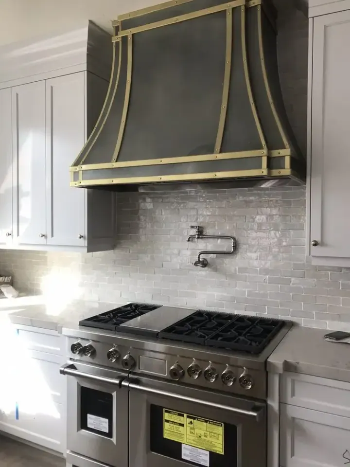 Wolf 48″ Range and Custom Black and Gold Hood installation in Buena Park by Peerless Group