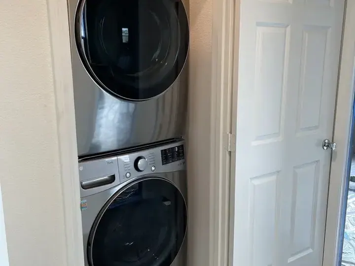 Stacked Front-Load Laundry installation in Costa Mesa by Peerless Group