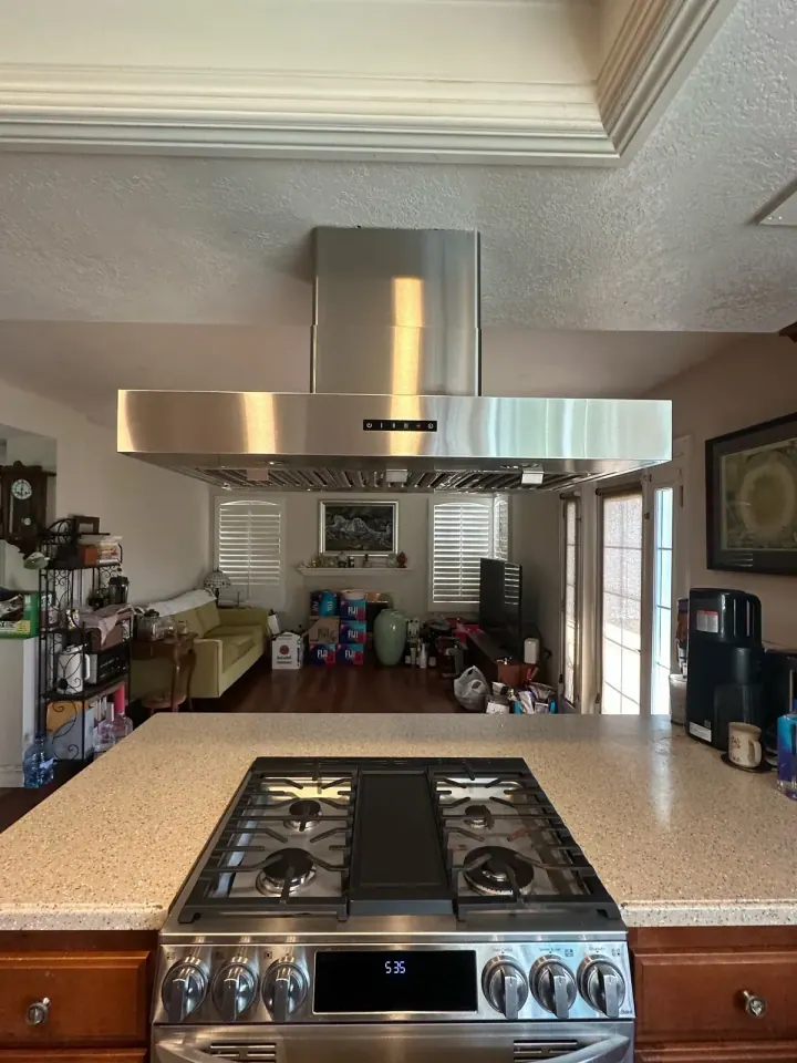 30″ Range and Island Hood installation in Newport Beach by Peerless Group
