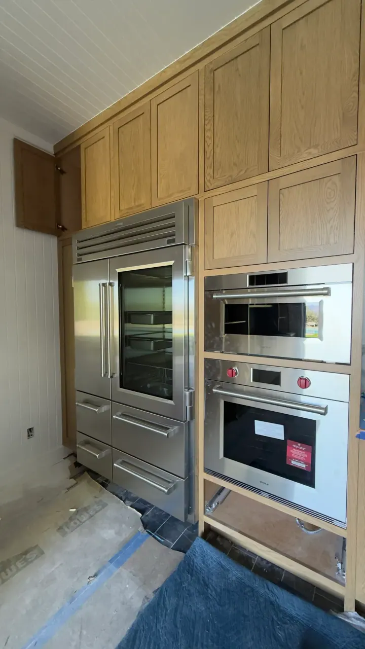 Sub-Zero 48″ PRO Refrigerator/Freezer with Glass Door & Wolf Ovens installation in San Clemente, CA by Peerless Group