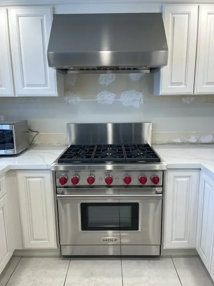 Wolf 36″ Range and Wolf Hood installation in Laguna Niguel by Peerless Group