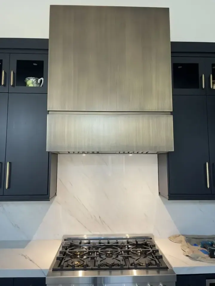 Bronze Custom Range Hood installation in Laguna Niguel by Peerless Group