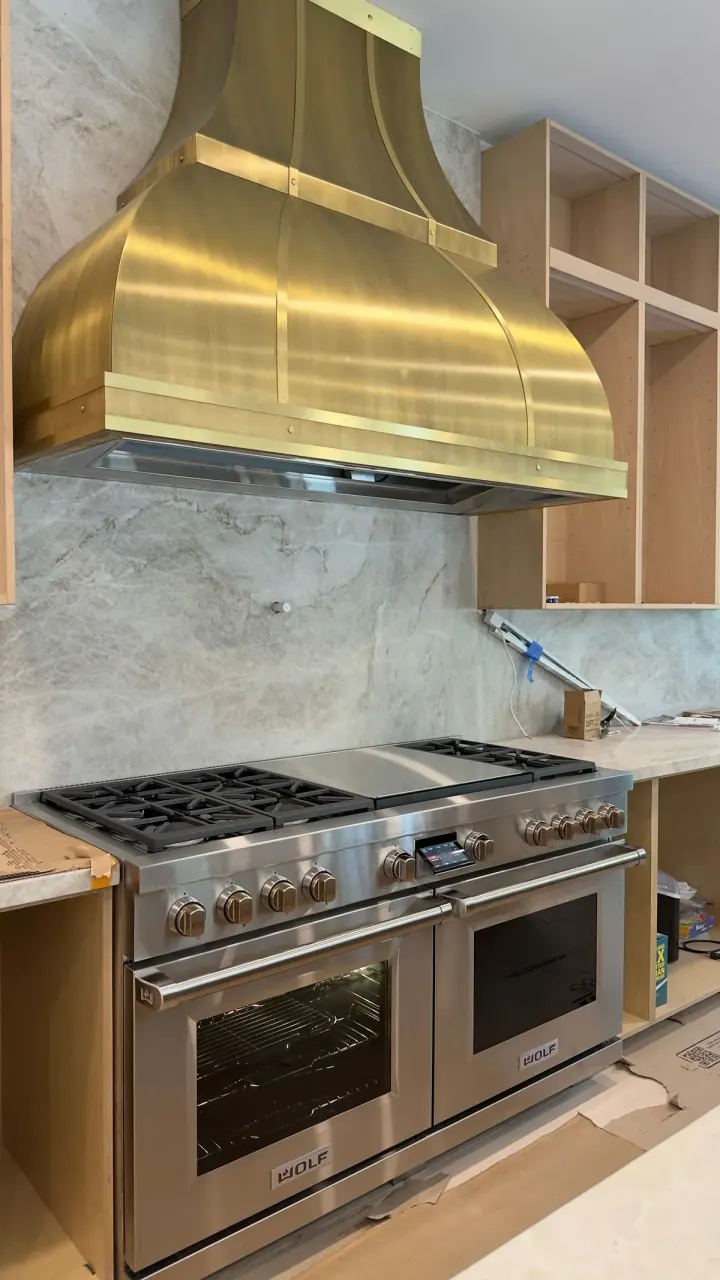 Wolf Dual Fuel Range 60″ & Custom Gold Hood installation in San Juan Capistrano, CA by Peerless Group