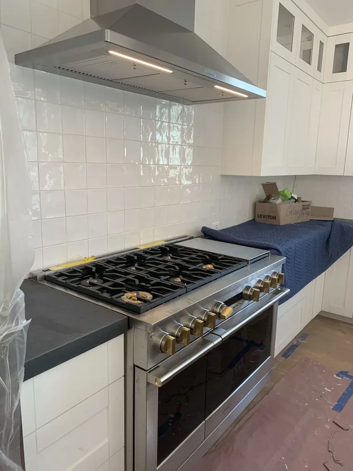 Professional Range & Hood installation by Peerless Group