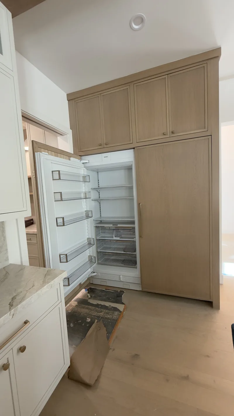 Sub-Zero Columns with Custom Wood Panel installation in Newport Beach by Peerless Group