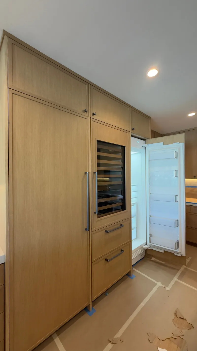 Sub-Zero Columns & Wine Column Custom Wood Panel installation in Newport Beach by Peerless Group