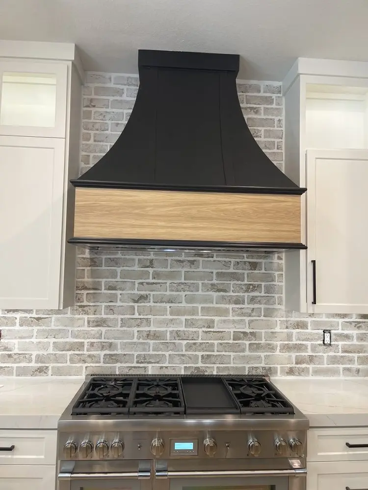 Tapered Black Vent Hood installation in Newport Coast