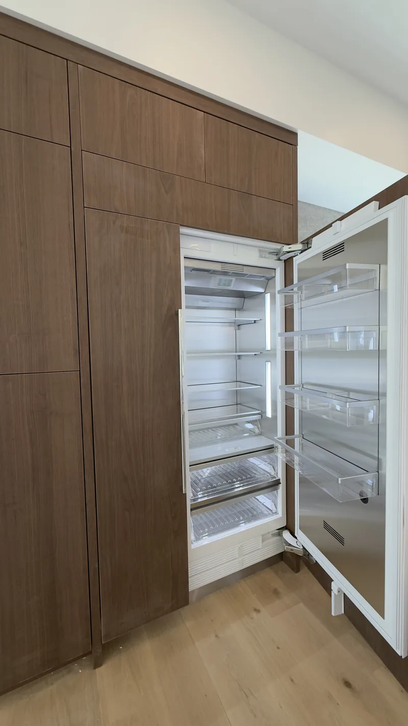 Thermador Columns with Custom Wood Panel installation in San Clemente by Peerless Group