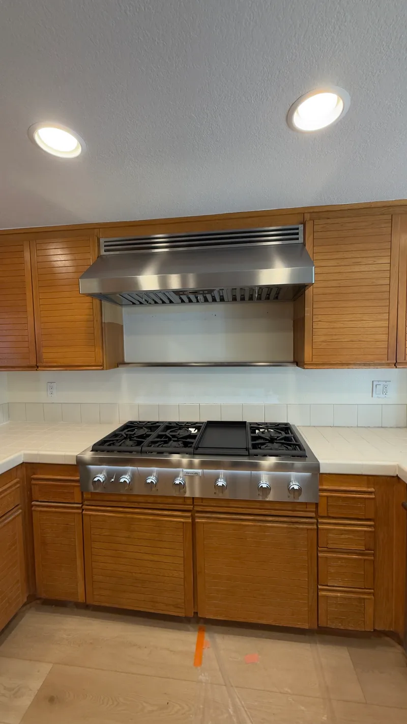 Thermador Rangetop and Zephyr Hood installation in Laguna Niguel by Peerless Group