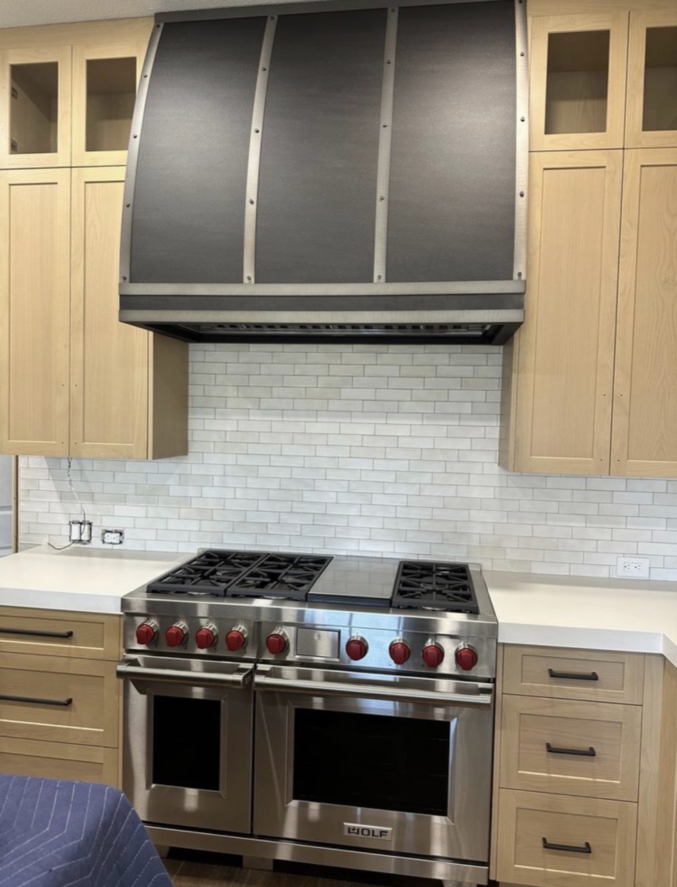 Wolf range and custom range hood installation in Newport Coast, CA by Peerless Group