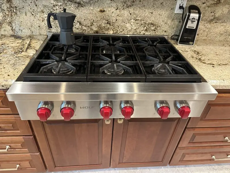 Wolf Rangetop with Red Knobs installation in Dana Point